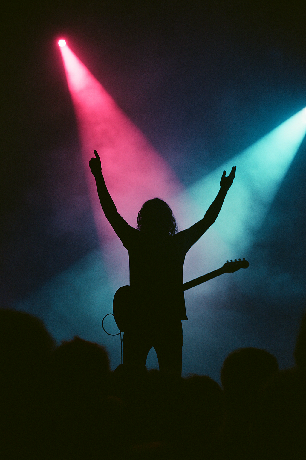 Musician silhouette under stage lights